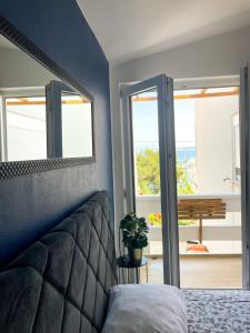 Postel nebo postele na pokoji v ubytování Apartman's M4 Stay by the Sea Kali
