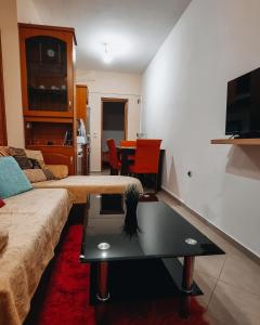 a living room with a couch and a coffee table at Mountain View in Konitsa