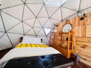 Postel nebo postele na pokoji v ubytování Glamping Xochitepec