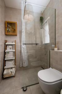 a bathroom with a toilet and a glass shower at Apartment Ivy in Split