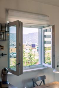 a kitchen window with a view of a city at Apartment Ivy in Split