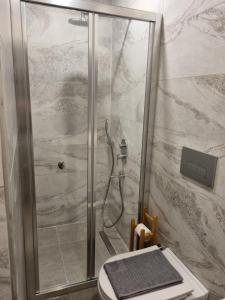 a shower with a glass door in a bathroom at El Mundo Suites in Antalya