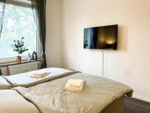 Кровать или кровати в номере Apartment für 3 Gäste Messe- und Citynah