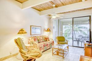 a living room with a couch and two chairs at Kona Bali Kai #418 in Kailua-Kona