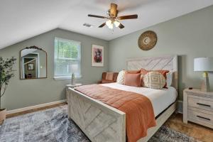 a bedroom with a bed and a ceiling fan at The Clark at Midtown Memphis in Memphis