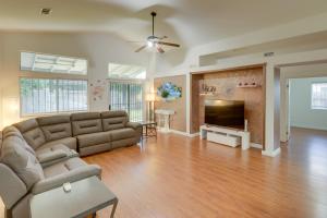 a living room with a couch and a television at Pet-Friendly California Retreat with Fenced-In Yard! in Bakersfield