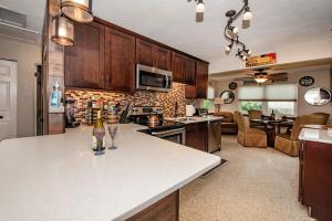 a kitchen with a white counter top in a room at Gulfport Beach Vacation Rental in St. Petersburg