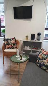 a living room with a couch and a table at Pasta Factory Guest Rooms in Galway