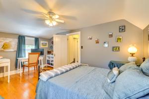 a bedroom with a bed and a desk and a chair at Pet-Friendly Gloversville Cottage Near Golf Course in Gloversville