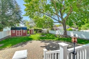 a backyard with a white fence and a smallshed at Pet-Friendly Gloversville Cottage Near Golf Course in Gloversville