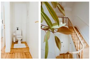 a bathroom with a toilet and a staircase at Ambiorix Residence in Brussels