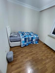 a bedroom with a bed and a wooden floor at B.A.A Sabiha Gökçen in Istanbul