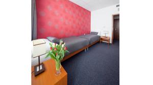 Postel nebo postele na pokoji v ubytování Hotel Limba CTT