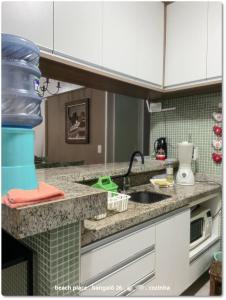 a kitchen with a sink and a counter top at Beach Place Resort . ap térreo in Aquiraz