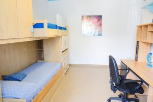 A bed or beds in a room at Il Mosaico Al Mare