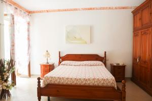A bed or beds in a room at Il Mosaico Al Mare