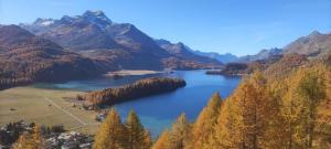 a lake in the middle of a mountain range at Posta Veglia in Sils Baselgia