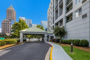 a driveway with a parking garage in front of a building at Sonesta Select Atlanta Midtown Georgia Tech in Atlanta