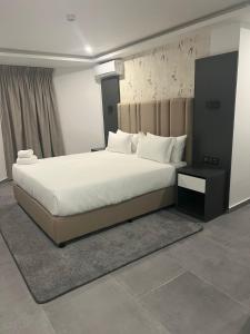 Ένα ή περισσότερα κρεβάτια σε δωμάτιο στο INCANTO RESIDENCIAL