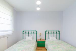 Postel nebo postele na pokoji v ubytování KANPONDOA ETXEA