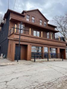 a large house with a balcony on top of it at Randolph Hotel in Fox Lake