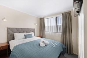 ASURE Oakleigh Motel客房内的一张或多张床位