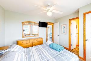 a bedroom with a bed and a ceiling fan at Diamond Dunes #4-F in Frisco +39 photos