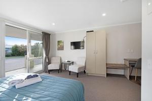 ASURE Oakleigh Motel客房内的一张或多张床位