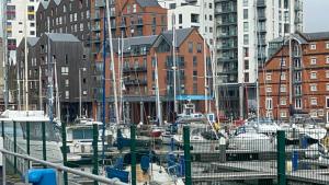 a group of boats docked in a harbor with buildings at The Grange Luxe2 in Ipswich