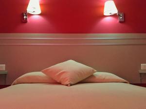 Łóżko lub łóżka w pokoju w obiekcie Hotel Carmen Teresa