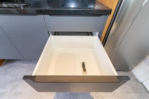 a drawer in a kitchen with a sink at Housi Brickell One - HBO0105 in Curitiba