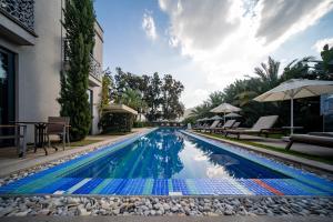 a swimming pool in the middle of a house at Sandora Boutiuqe Hotel in Yalıkavak