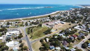 an aerial view of a suburb next to the ocean at Sail House overlooking Lancelins main park in Lancelin