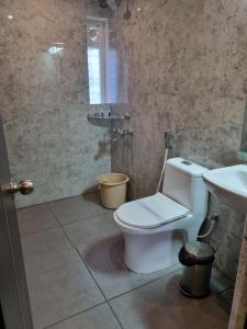 Koupelna v ubytování PLUTUS RESIDENCY