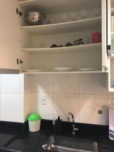 Køkken eller tekøkken på Conforto aproveitando Santos!