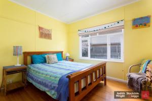 a bedroom with a bed and a window at Heyley Haven in Ventnor