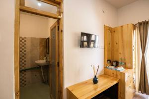 a bathroom with a sink and a toilet and a shower at Zostel Leh in Leh