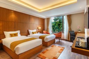Letto o letti in una camera di Hotel Thrive, A Tropical Courtyard