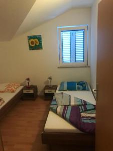 Postel nebo postele na pokoji v ubytování Apartmaji Jelena Piran