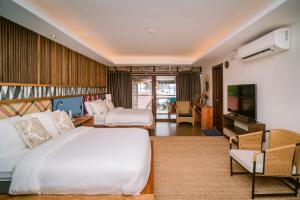 Postel nebo postele na pokoji v ubytování Banig Beach Resort El Nido + 28 fotografií