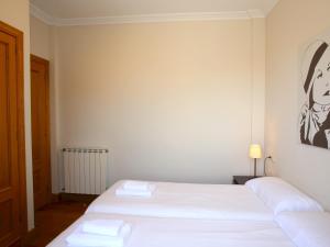 A bed or beds in a room at Centenario