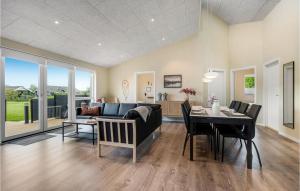 a living room with a couch and a table at Stunning Home In Hemmet With Wifi in Hemmet