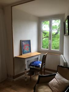 a room with a table and a chair and a window at La FortBelle in Beaufort