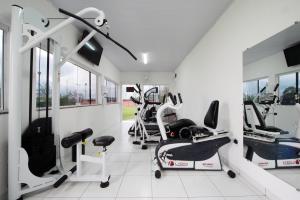 a gym with treadmills and machines in a room at Hotel ITR-SPA in Itupeva