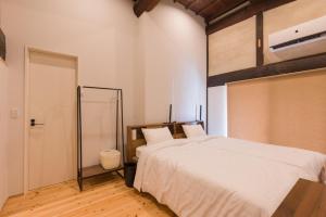 Postel nebo postele na pokoji v ubytování FARMSTAY miyuki-street "Goen"