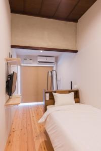 Postel nebo postele na pokoji v ubytování FARMSTAY miyuki-street "Goen"