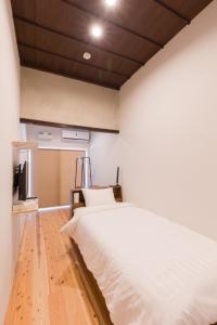 Postel nebo postele na pokoji v ubytování FARMSTAY miyuki-street "Goen"