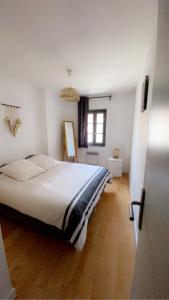 Кровать или кровати в номере Duplex ZEN Intra-Muros