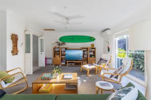 a living room with a green ceiling at Celeste, 26 Bonito Street - Tranquil, Stylish & Pet friendly in Corlette
