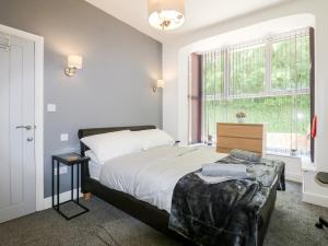 A bed or beds in a room at The Beach House